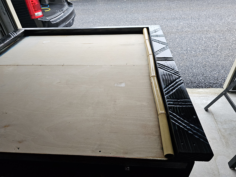 First bamboo cut placed on frame