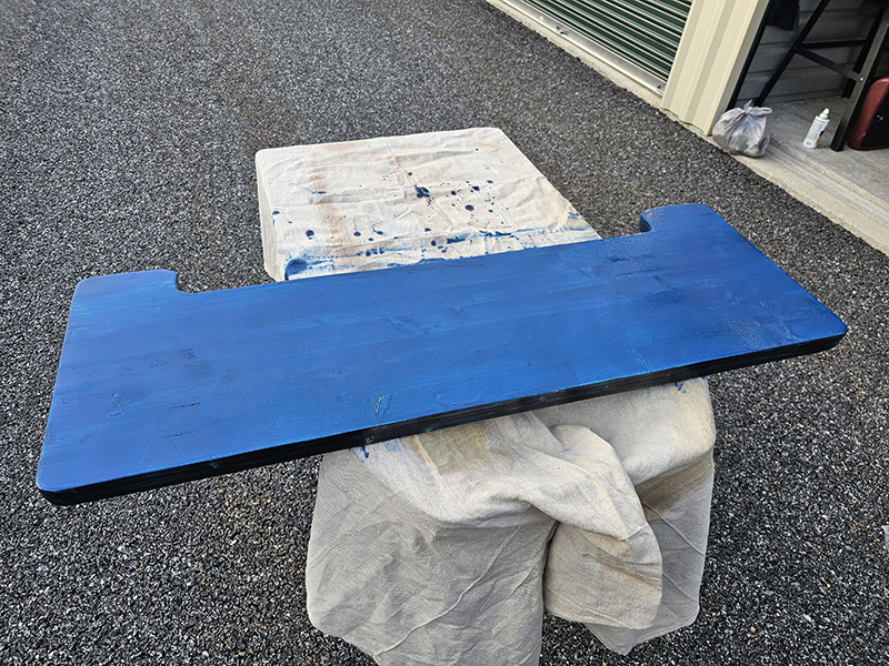 Bar top stained blue before wiping