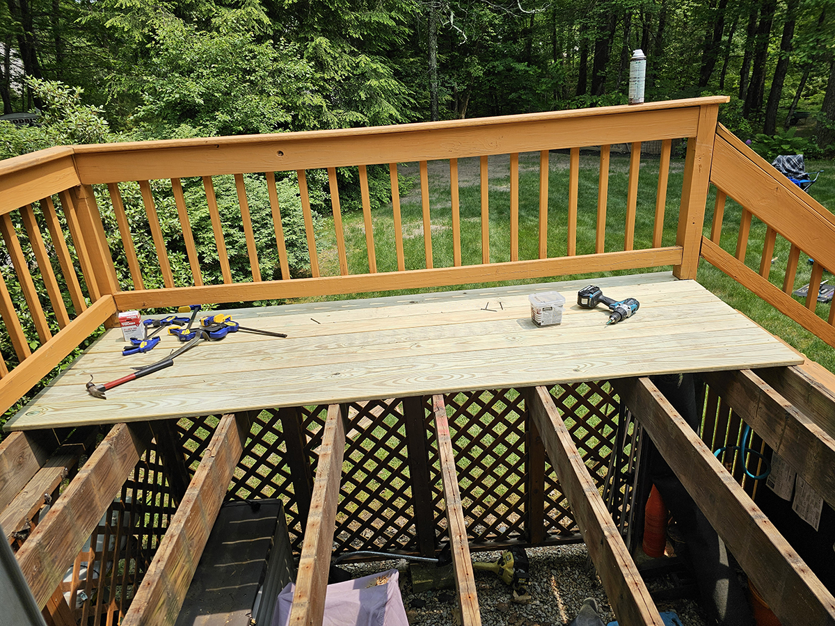 New boards partially installed and old ones fully removed