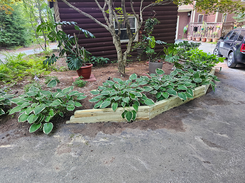Left side view of garden retaining wall showing slope and alignment